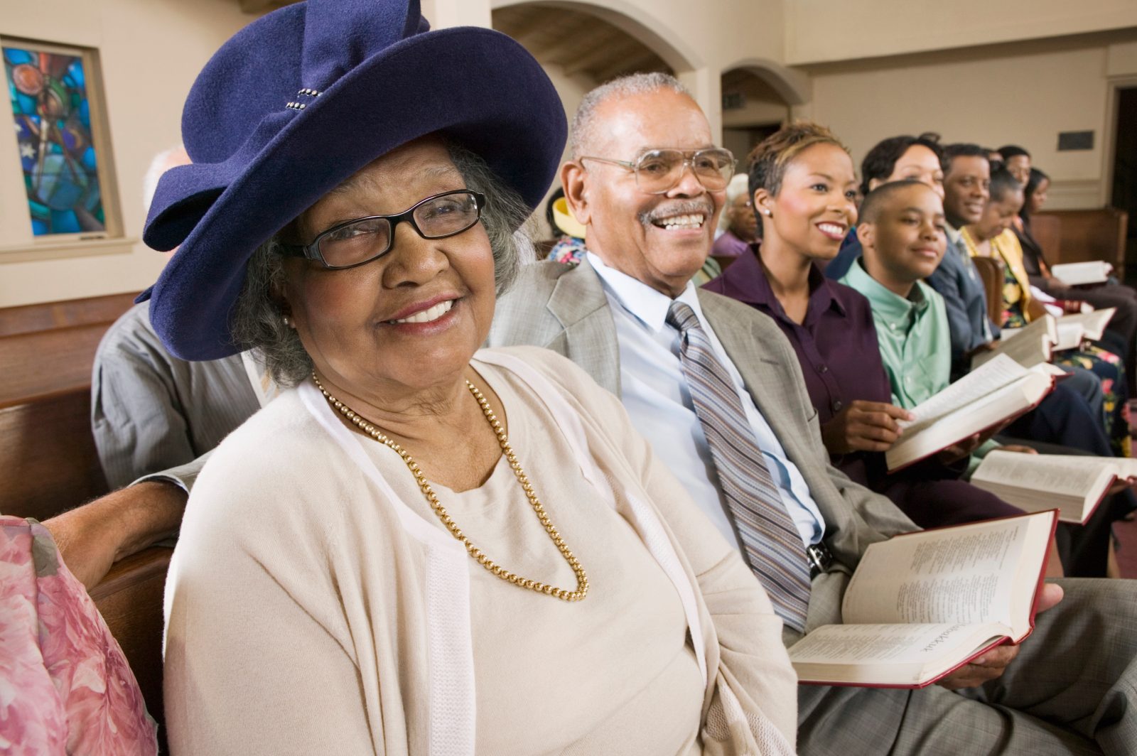 AdobeStock_129841167 Senior Woman in Sunday Best at Church