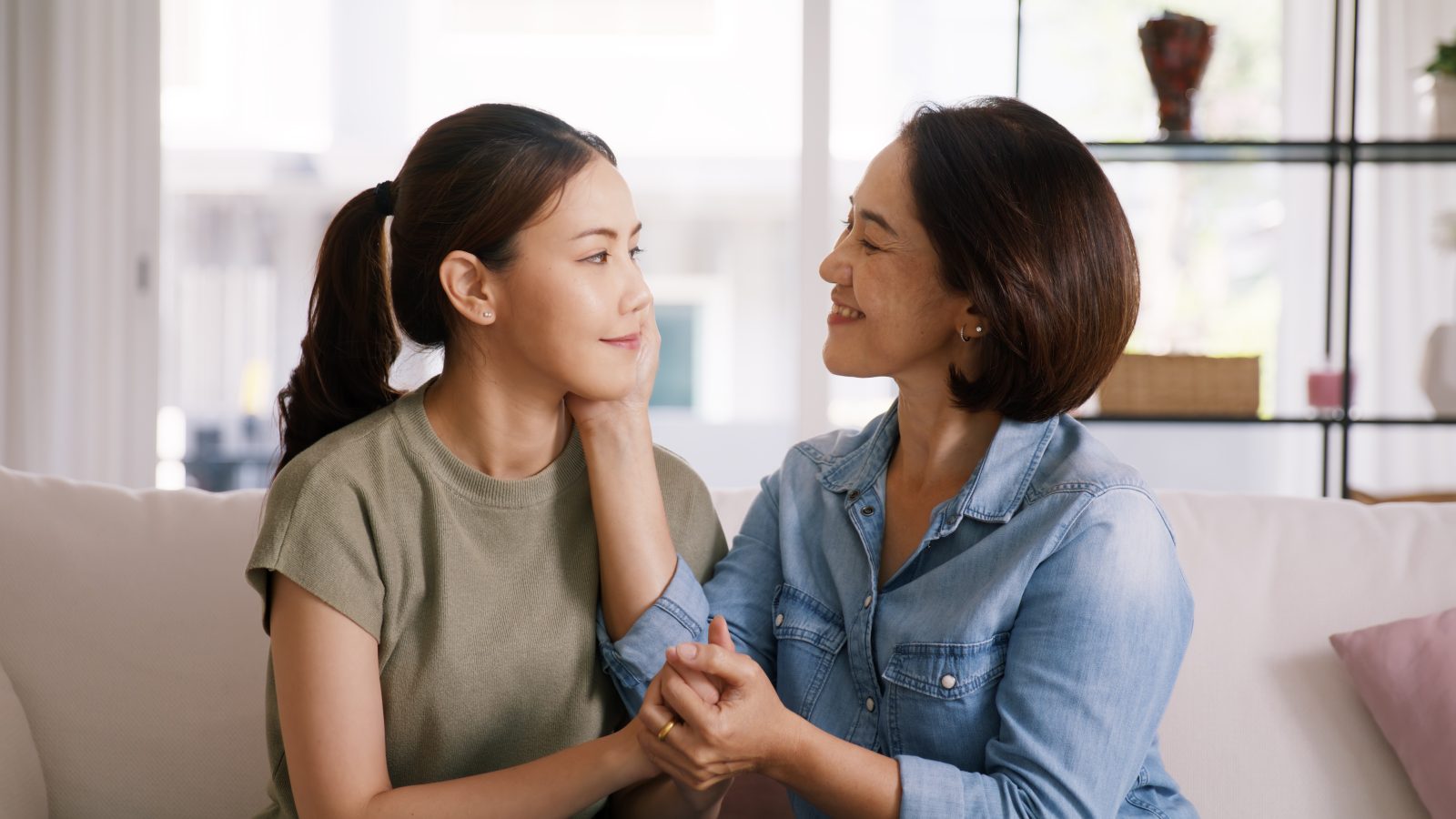 Middle aged asia people old mom love care trust comfort help you Middle aged asia people old mom love care trust comfort help young teen talk crying stress relief at home. Mum as friend listen adult child woman feel pain sad worry of broken heart life crisis issues