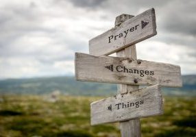 prayer changes things text on signpost