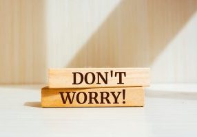 Wooden blocks with words 'Don't Worry'.